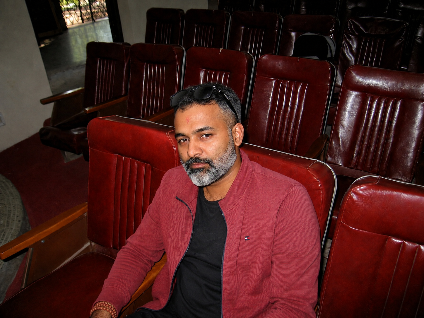 Bhasker Kode seated in a theater